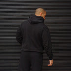 polerón oversize con gorro negro - vista trasera
