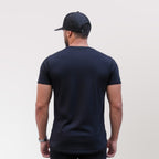 Polera long fit cruz Dsanti vista de espalda